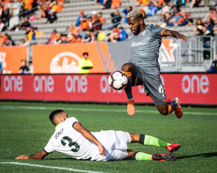 HAMILTON, ON, Oct. 6, 2019: Christopher Nanco of Forge FC jumps over Morey Doner of York9 FC in Canadian Premier League action.