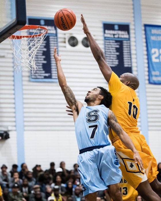 BRAMPTON, ON, Feb. 4, 2017: Dylan Periana twists and turns for a lay-up in the 100th regular season meeting between the Sheridan Bruins and the Humber Hawks.