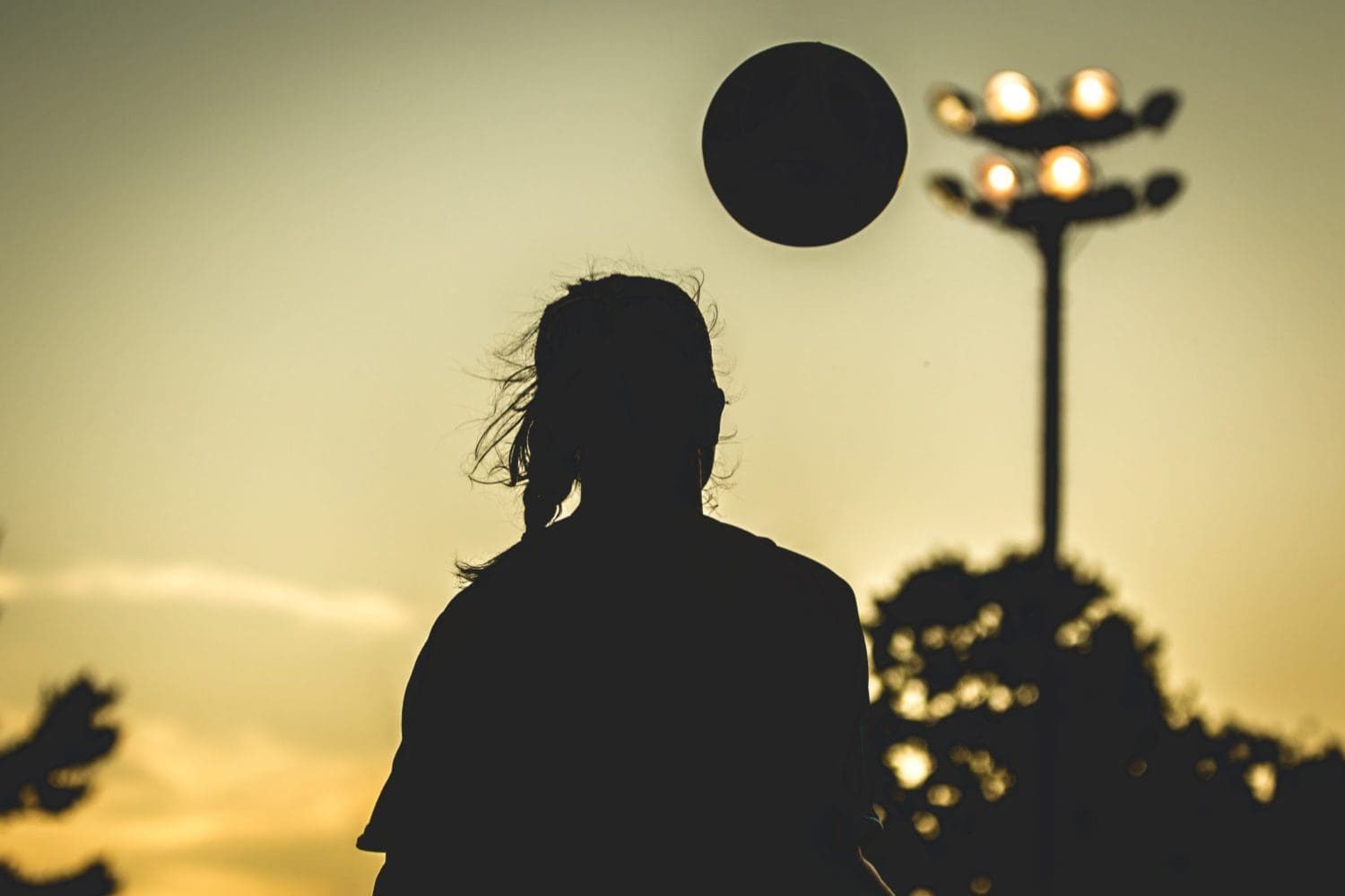 OAKVILLE, ON – AUG. 22, 2016: A player brings the ball under control as darkness begins to set.