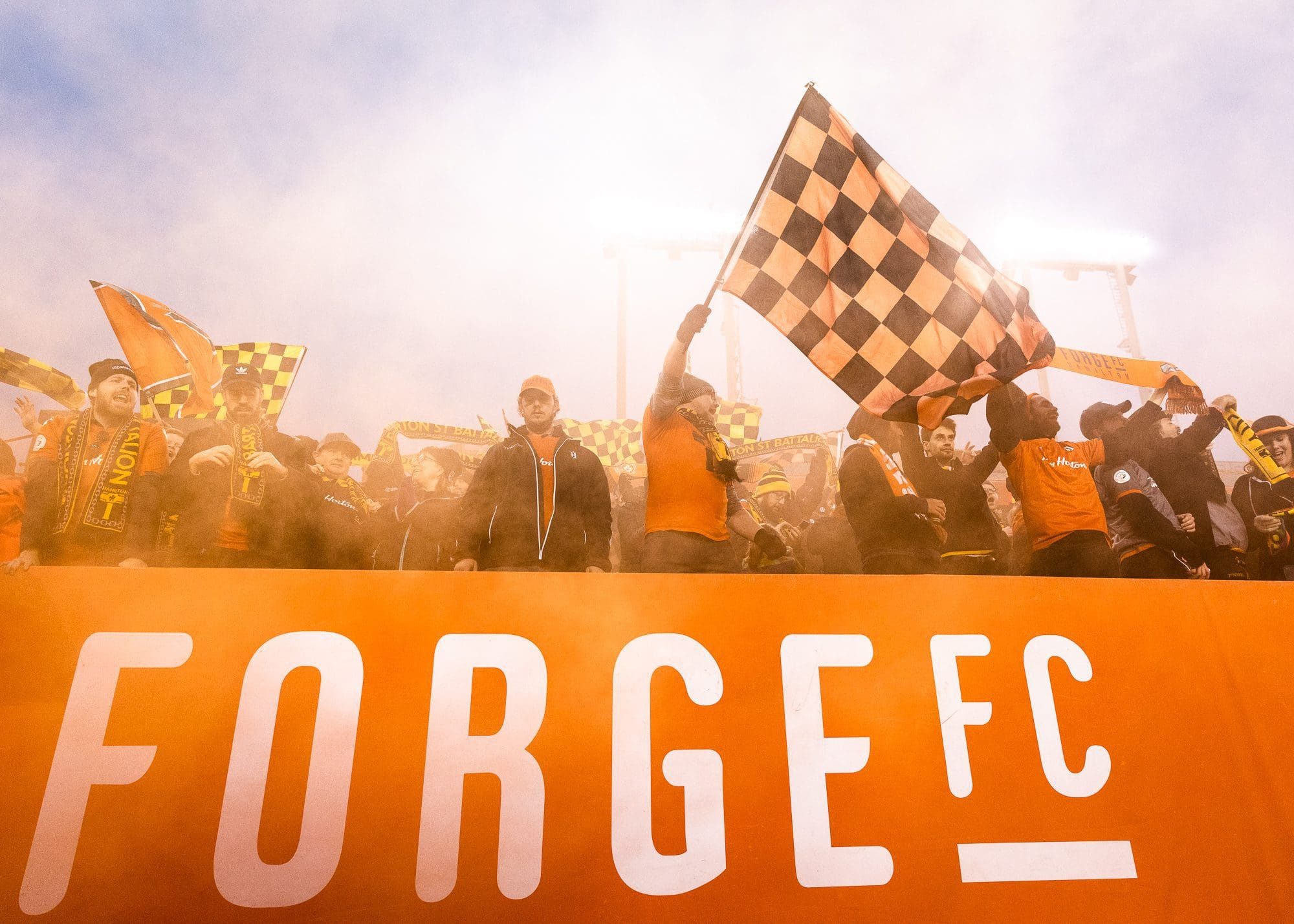 HAMILTON, ON – OCT. 26, 2019: Forge FC fans celebrate at Tim Hortons Field after a 1-0 win over Cavalry FC in the first leg of the Canadian Premier League Finals.