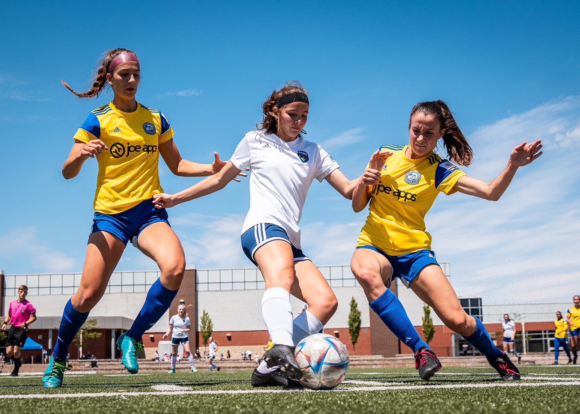 BURLINGTON, ON – JUN. 19, 2022: Players from Darby FC and Burlington SC battle for the ball during League1 Ontario regular season action. BURLINGTON, ON – JUN. 19, 2022: Players from Darby FC and Burlington SC battle for the ball during League1 Ontario regular season action.
