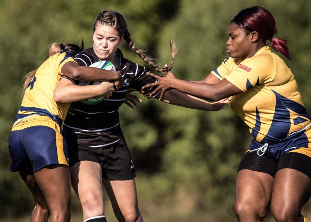 OAKVILLE, ON - Nov. 5, 2016: Humber players attempt to rip the ball from a Conestoga attacker at the inaugural OCAA Women's Rugby Sevens Championship.