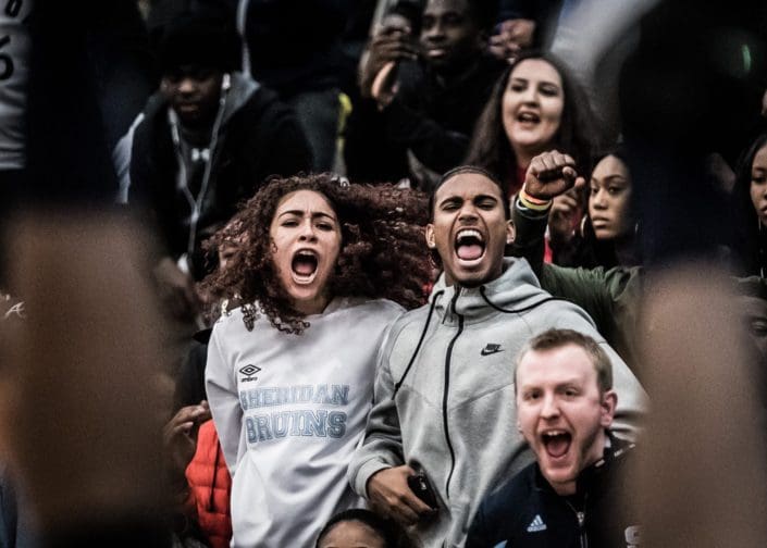 TORONTO, ON – MAR. 3, 2017: Sheridan fans react after Paul Williams drains a basket (in the foreground) and gets the foul. TORONTO, ON – MAR. 3, 2017: Sheridan fans react after Paul Williams drains a basket (in the foreground) and gets the foul.