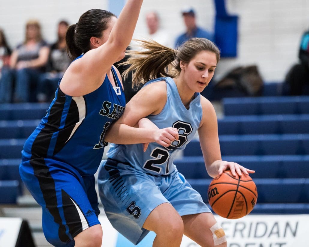 BRAMPTON, ON - Feb. 11, 2017: Jennifer Saltarelli of the Sheridan Bruins is guarded by a Sault defender while driving to the hoop.