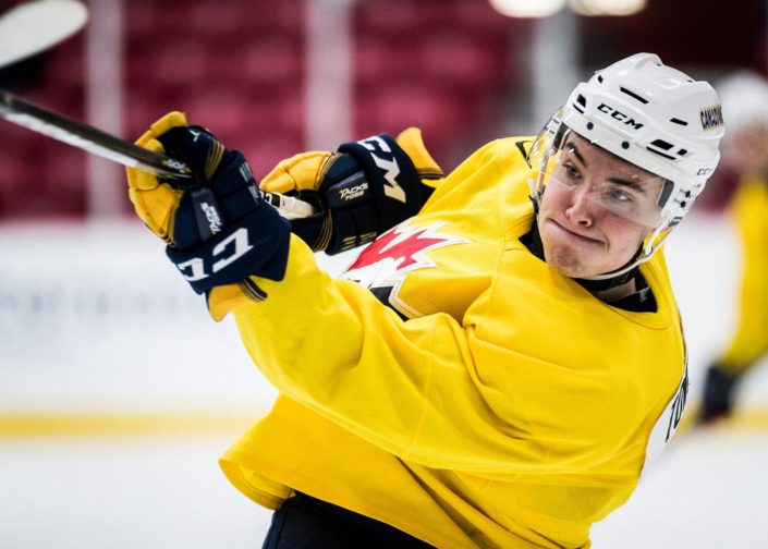 TORONTO, ON – DEC. 4, 2017: World Junior “A” Challenge. Team Canada East Selection Camp 2017. Player clears the puck during the second period. TORONTO, ON - DEC. 4, 2017: World Junior