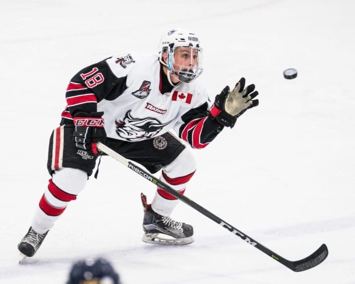 GEORGETOWN, ON – JAN. 31, 2018: Brendan D’Agostino of the Georgetown Raiders catches a flying puck. GEORGETOWN, ON - JAN. 31, 2018: Brendan D'Agostino of the Georgetown Raiders catches a flying puck.