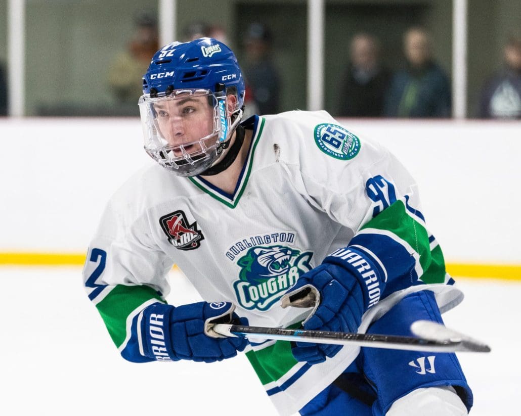 BURLINGTON, ON - MAR. 7, 2019: Matthew Steen of the Burlington Cougars cycles around the boards during the first period.